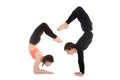 Yogi couple in yoga Scorpion Pose Royalty Free Stock Photo