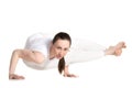 Yogi female in asana Astavakrasana Royalty Free Stock Photo