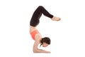 Yogi female in yoga Scorpion Pose Vrischikasana 1 Royalty Free Stock Photo