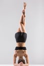 Yogi girl in headstand, asana Sirsasana, Shirshasana, Sirshasana Royalty Free Stock Photo