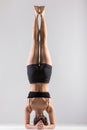 Yogi girl in headstand, asana Sirsasana, Shirshasana, Sirshasana