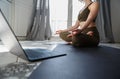 Yogi girl meditating during online yoga class at home