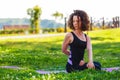 Yogi girl stretching back before workout. Young yogini athlete stretches back muscles