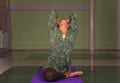 Yogi teaching yoga in a studio