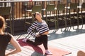 Yogi woman and diverse group of sporty people practicing yoga Royalty Free Stock Photo