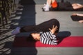 Yogi woman and diverse group of sporty people practicing yoga Royalty Free Stock Photo