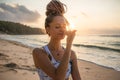 Yogi woman practicing Nadi Shodhana Pranayama, Alternate Nostril Breathing. Control prana, control of breath. Breathing exercise. Royalty Free Stock Photo