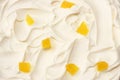 Yogurt background with pineapple pieces. yogurt texture. top view