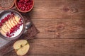 Yogurt with banana, kiwi fruit , raspberries ,garnet and flax seeds .