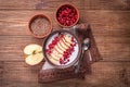 Yogurt with banana, kiwi fruit , raspberries ,garnet and flax seeds .