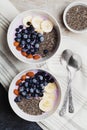 Yogurt with berries, banana, almonds and Chia seeds, bowl of healthy Breakfast every morning, vintage style, superfood and detox Royalty Free Stock Photo