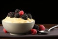 Yogurt and berry bowls with spoon and towel on bright white and yellow background, space for text