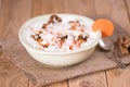 Yogurt with carrots and walnuts. Rustic.