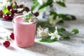 Yogurt with cherry, mint and and fresg berries on a light concrete background. Summer healthy dessert with berries