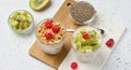 Yogurt and chia seed pudding in a glass, kiwi pieces. White table Royalty Free Stock Photo
