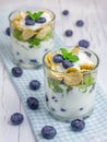 Yogurt dessert with blueberry, kiwi and cereals Royalty Free Stock Photo