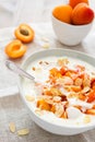 Yogurt with fresh apricots and almond slivers