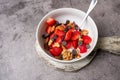 Yogurt and fruit in a bowl. Greek yogurt with fruit and nuts, healthy diet friendly dessert.