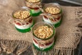Yogurt with granola, decorated for Christmas with red and green jelly and jello. Christmas glass jar dessert