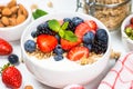 Greek yogurt granola with fresh berries on white table. Royalty Free Stock Photo