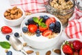 Greek yogurt granola with fresh berries on white table. Royalty Free Stock Photo
