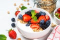 Greek yogurt granola with fresh berries on white table. Royalty Free Stock Photo