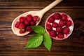 Yogurt with granola, raspberry and raspberry jam on dark wooden background Royalty Free Stock Photo