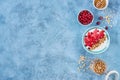 Yogurt with granola and red grapefruit, pomegranate for healthy breakfast. Bowl of greek yogurt with granola , honey and fresh Royalty Free Stock Photo