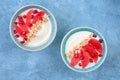 Yogurt with granola and red grapefruit, pomegranate for healthy breakfast. Bowl of greek yogurt with granola , honey and fresh Royalty Free Stock Photo