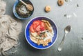 Yogurt, granola, seeds, berry and honey in blue ceramic bowl Royalty Free Stock Photo