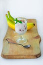 Yogurt Jelly Dessert with banana, strawberry, cocoa, fresh mint in a glass on wooden cut board.Healthy vegan sweet jello Royalty Free Stock Photo