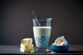 yogurt in large glass cheese and dairy product on gray blue table