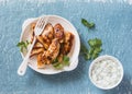 Yogurt marinated grilled chicken breast on a blue background Royalty Free Stock Photo