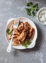 Yogurt marinated grilled chicken breast on a gray background Royalty Free Stock Photo