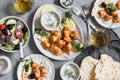 Yogurt marinated grilled chicken skewers with vegetables and tzatziki. Top view Royalty Free Stock Photo