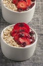 Yogurt with oat flake and fresh berries for healthy morning meal put on white wood background, Royalty Free Stock Photo