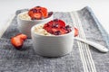 Yogurt with oat flake and fresh berries for healthy morning meal put on white wood background, Royalty Free Stock Photo