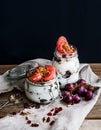 Yogurt and oat granola with grapes, pomegranate, grapefruit in t