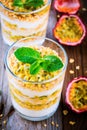 Yogurt parfait with granola, peach sauce and passion fruit with mint Royalty Free Stock Photo