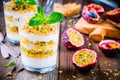 Yogurt parfait with granola, peach sauce and passion fruit with mint Royalty Free Stock Photo