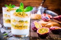 Yogurt parfait with granola, peach sauce and passion fruit with mint Royalty Free Stock Photo