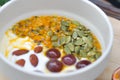 Yogurt with passion fruit, almond ,sunflower seed and grape