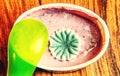 Yogurt in plastic cup close up with spoon, top view photo Royalty Free Stock Photo