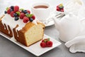 Yogurt pound cake with glaze and fresh berries Royalty Free Stock Photo