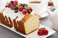 Yogurt pound cake with glaze and fresh berries Royalty Free Stock Photo