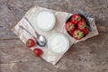 Yogurt with strawberries in a glass and a bucket with fresh stra