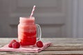 Yogurt and strawberry smoothie in jar on wooden table Royalty Free Stock Photo