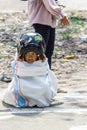 Children wearing a helmet having a sack race Royalty Free Stock Photo