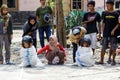 Children wearing a helmet having a sack race Royalty Free Stock Photo