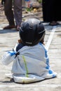 Children wearing a helmet having a sack race Royalty Free Stock Photo